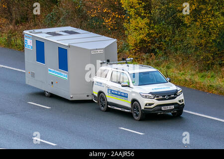 2019 white SsangYong Musso Saracen Auto; UK Vehicular traffic, transport, modern vehicles, saloon cars, south-bound motoring on the 3 lane M6 motorway highway. Stock Photo