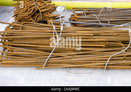 Rusty steel bars in group to be used on construction site Stock Photo