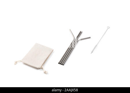 Set of Ecological stainless steel straw with cloth pouch and a cleaning brush on a white background for multiple use. Stock Photo