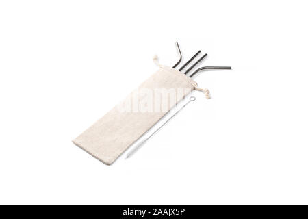 Set of Ecological stainless steel straw with cloth pouch and a cleaning brush on a white background for multiple use. Stock Photo