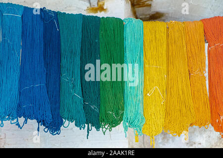 wools and yarns colored from blue to orange at the shows Stock Photo