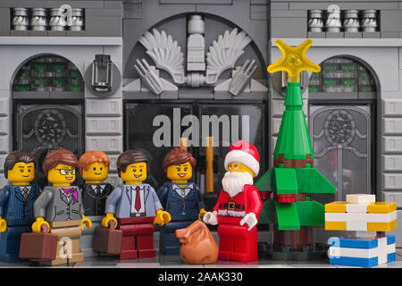 Tambov, Russian Federation - November 21, 2019 Lego Santa Claus giving gifts to businessmen. Stock Photo