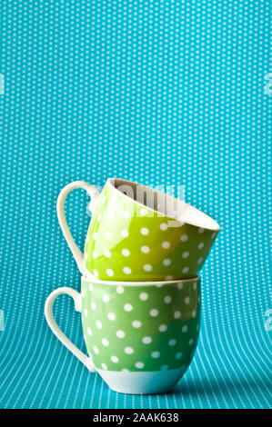 two empty green cups of coffe on a blue background Stock Photo