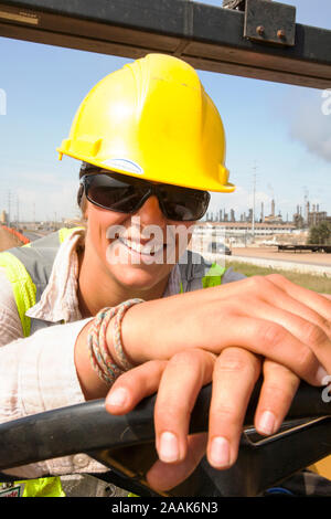 Ali Walker drives a large road rolling machine at the Syncrude, Mildred Lake tar sands plant. Like many workers, Ali was attracted by the huge salarie Stock Photo