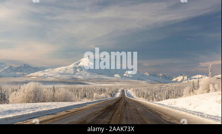 Hoarfrost covers the boreal forest along the Glenn Highway with Gunsight Mountain in Southcentral Alaska. Stock Photo