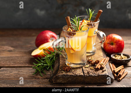 Christmas mulled apple cider with cinnamon and anise, traditional winter warming hot drink, beverage or cocktail Stock Photo