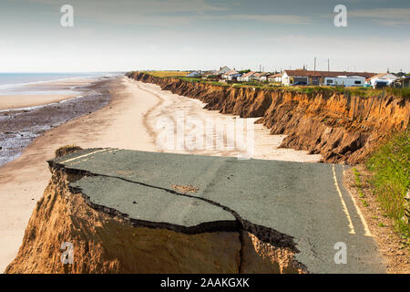 A collapsed coastal road between Skipsea and Ulrome on Yorkshire's East Coast, UK. The coast is composed of soft boulder clays, very vulnerable to coa Stock Photo