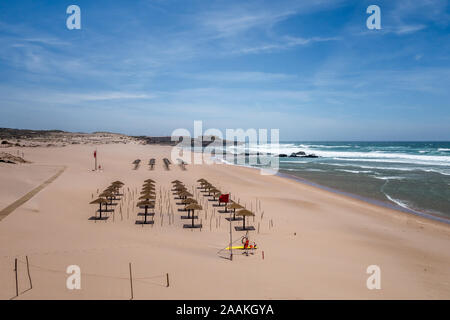 Guincho Beach - Praia do Guincho - in Cascais Portugal on sunny windy day without people and prepared for people arriving to beach. Stock Photo