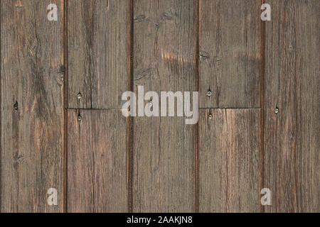 worn wall made of wooden planks with visible screws background texture Stock Photo