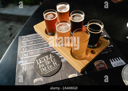 A Flight of beers selection at Letraria Craft Beer Garden in Porto Portugal. Stock Photo
