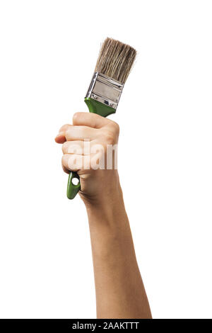 A raised female hand holds a brush for painting various surfaces. Worker with tool isolated on white background Stock Photo