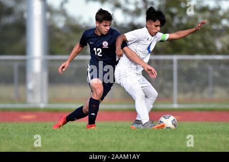 Opposing players battling for control of the ball. USA. Stock Photo