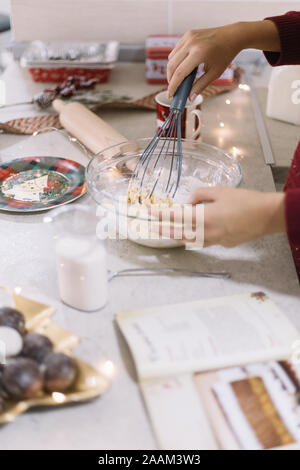 Close-up view of womans hands mixing cookies dough Stock Photo