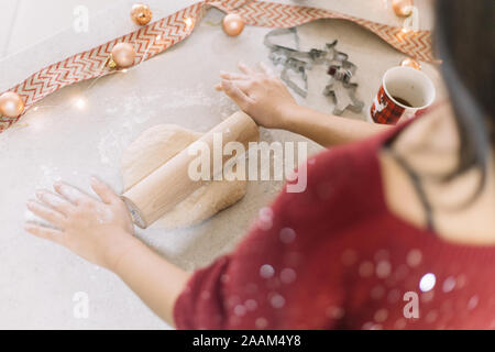 High angle view of womans hands rolling cookie dough Stock Photo