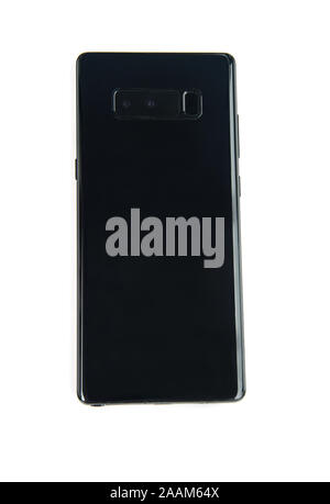 Cell phone isolated on light background, plain black for a mockup. Use to sell your digital designs of cell phone covers. Stock Photo