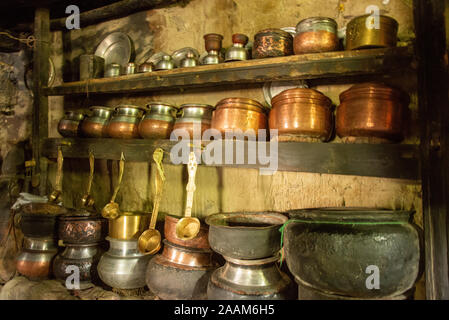 copper pots and pans in kitchen in old house in Nubra valley, Ladakh, India Stock Photo