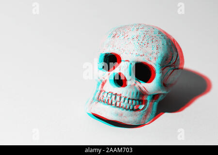 3D skull with shadows on grey background Stock Photo
