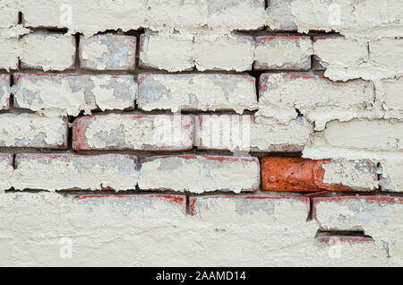 Abstract graphic close-up detail of red bricks on a white wall. Stock Photo