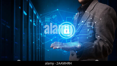 Man holding hologram projection displaying cloud technology symbols Stock Photo
