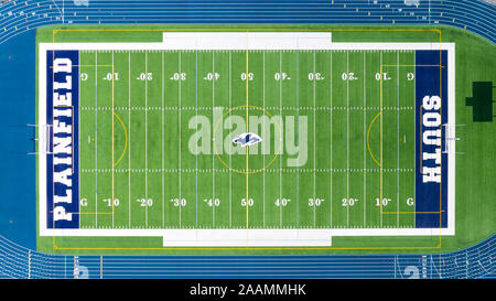 A drone/aerial view of the Plainfield South High School football field, surrounded by a blue running track. Stock Photo