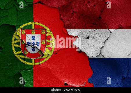 flags of Netherlands and Portugal painted on cracked wall Stock Photo ...