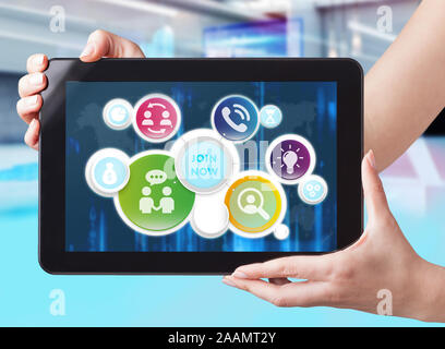 Business, Technology, Internet and network concept. Businessman working on the tablet of the future, select on the virtual display: join now Stock Photo