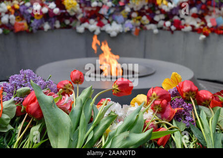 Tsitsernakaberd, The Armenian Genocide memorial complex. The eternal flame at the center of the twelve slabs. Yerevan, Armenia Stock Photo
