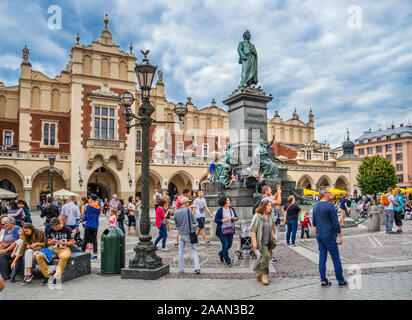 monument commemorating the nationalist writer & poet Adam Mickiewicz on Krakow's main square next to the iconic Cloth Hall, Krakow, Lesser Poland, Pol Stock Photo