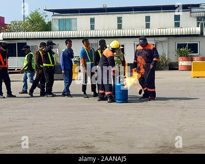 Firefighters come to teach and practice fire fighting for company employees. Stock Photo