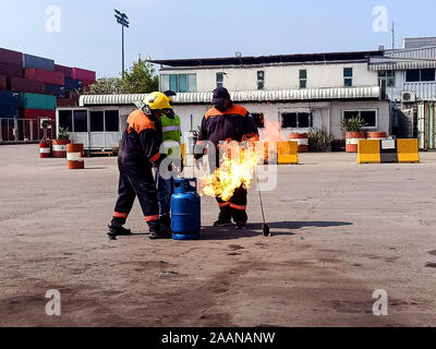 Firefighters come to teach and practice fire fighting for company employees. Stock Photo