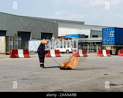 Firefighters come to teach and practice fire fighting for company employees. Stock Photo