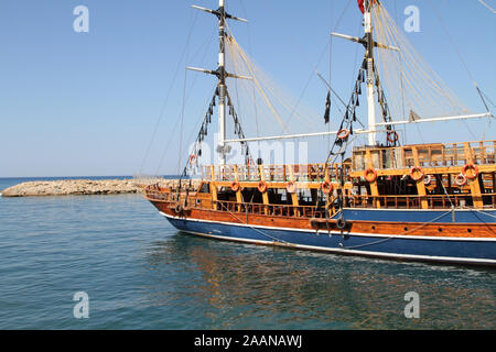 a sailing ship with tourists in the harbor Stock Photo