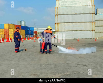 Firefighters come to teach and practice fire fighting for company employees. Stock Photo