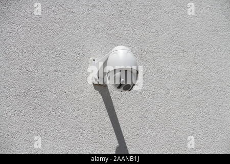 Security camera on a house wall Stock Photo