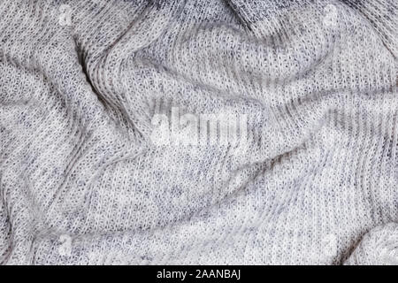 Gray cashemire fabric texture. Soft knitted woolen sweater background. Stock Photo