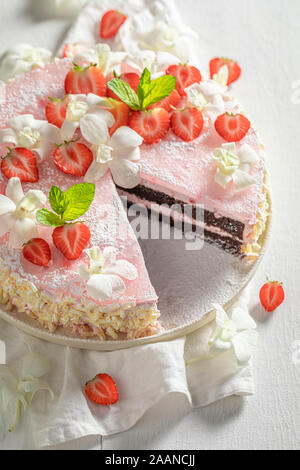 Fresh strawberry cake decorated with summer flowers Stock Photo