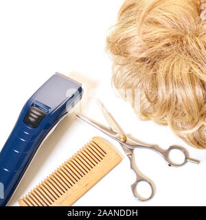 haircut tool and hair on a white background Stock Photo