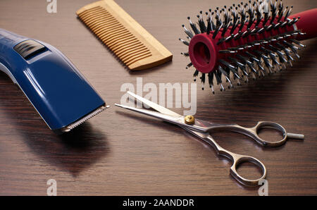 hairdressing tools for haircuts on a wooden background Stock Photo