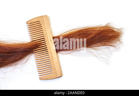 hairbrush with a lock of hair on a white background Stock Photo