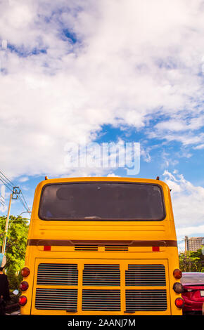 Orange bus and bright blue sky. Stock Photo