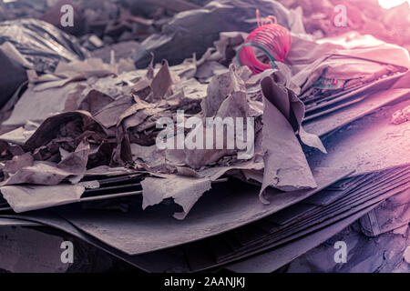 plastic floor tiles, garbage on the ground, asbestos, paper closeup Stock Photo