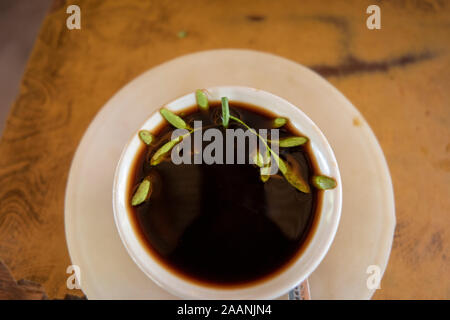 Ethiopia, South Omo, Weito, cup of local buna coffee flavoured with rota (rue herb Ruta graveolens) Stock Photo