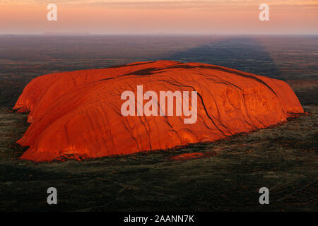 Aerial view of Uluru at sunrise, red center outback, Northern Territory, Australia Stock Photo