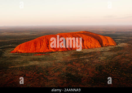 Aerial view of Uluru at sunrise, red center outback, Northern Territory, Australia Stock Photo