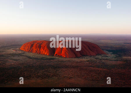 Aerial view of Uluru at sunrise, red center outback, Northern Territory, Australia Stock Photo