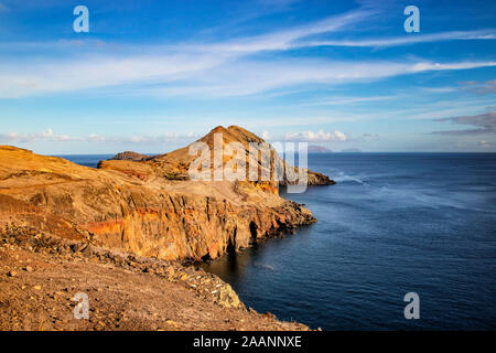 Sunset over Maderia island landscape, Ponta de sao Lourenco. It is nature background of a wonderful view of the sea cliffs, Portugal. It is a natural Stock Photo