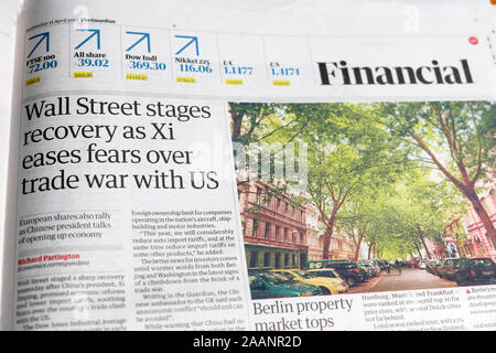 'Wall Street stages recovery as Xi eases fears over trade war with US' newspaper article in Guardian financial section 11 April 2018 London UK Stock Photo