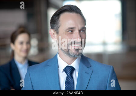 Close up of cheerful businessman feeling excited before negotiation Stock Photo