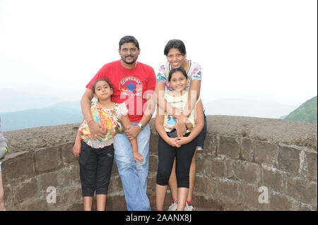 Pune; Maharashtra; India; Sept. 2015: Southeast Asia - Indian Family Parents with children at sinhagad fort Pune Stock Photo