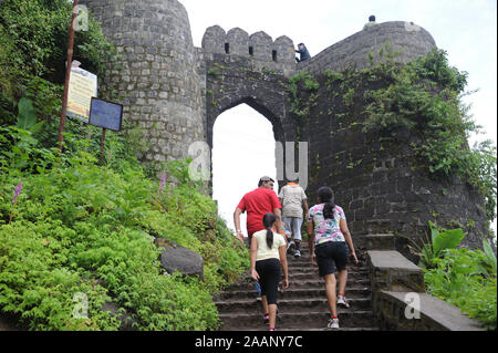 Pune; Maharashtra India; Sept. 2015: Southeast Asia - Indian Family Climbing  Sinhagad hill fortress Pune Stock Photo